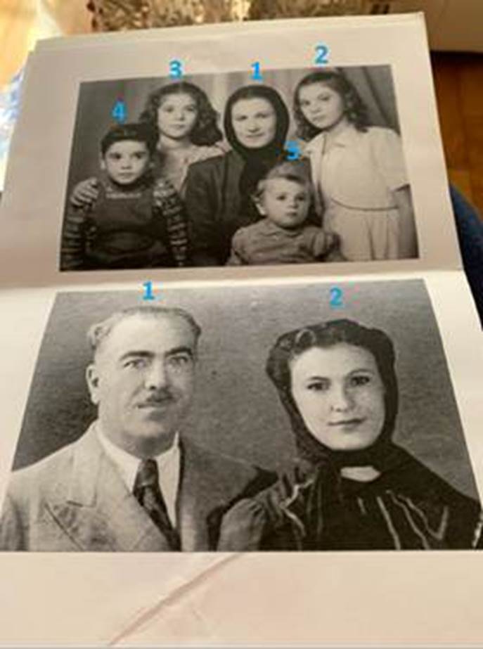 A black and white photo of a family

Description automatically generated