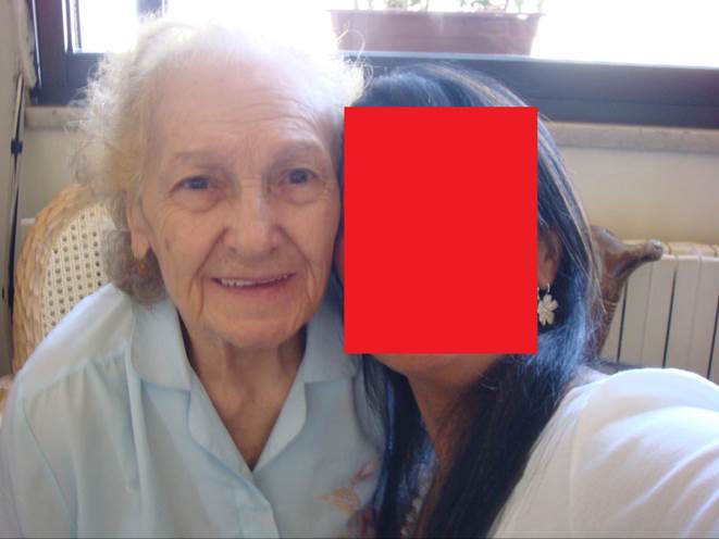 A person taking a selfie with a red square

Description automatically generated